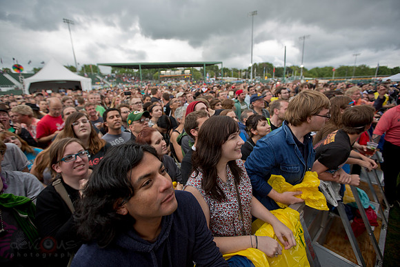 Crowd with storm clouds in the background