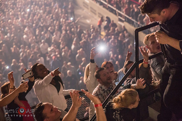 Marcus Mumford walking around Alliant Energy Center