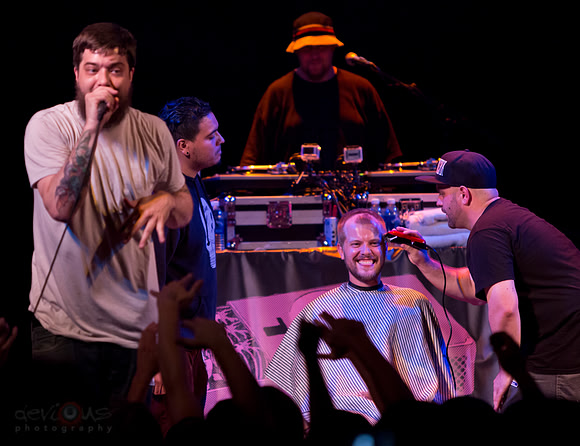 Aesop Rock rapping while dude gets terrible haircut on stage