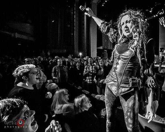 Cyndi Lauper singing "Girls Just Wanna Have Fun" from the crowd