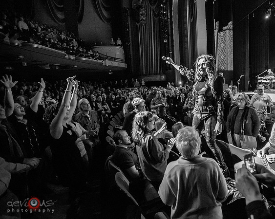 Cyndi Lauper singing "Girls Just Wanna Have Fun" from the crowd